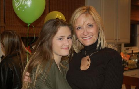 Brenda and her daughter, Bella, pictured together at an event. Brenda, on the left, has blonde hair and is wearing a black dress. Bella has dark brown hair and is wearing a dark gray shirt.