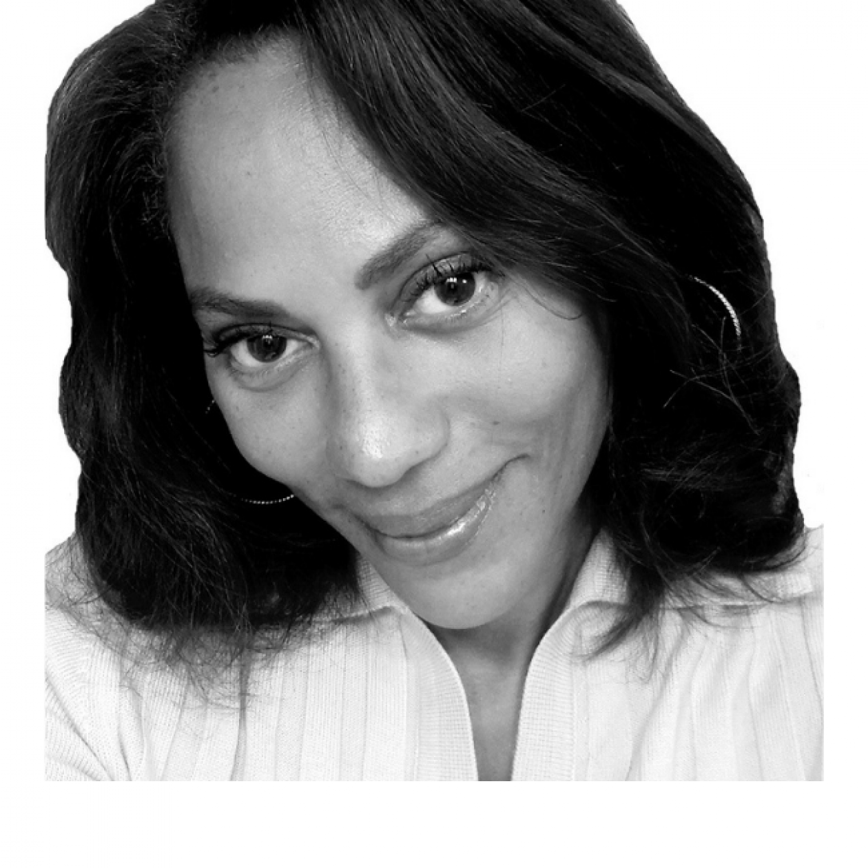 Monique Robinson smiling facing forward. The image is a black and white close-up of Monique's face.