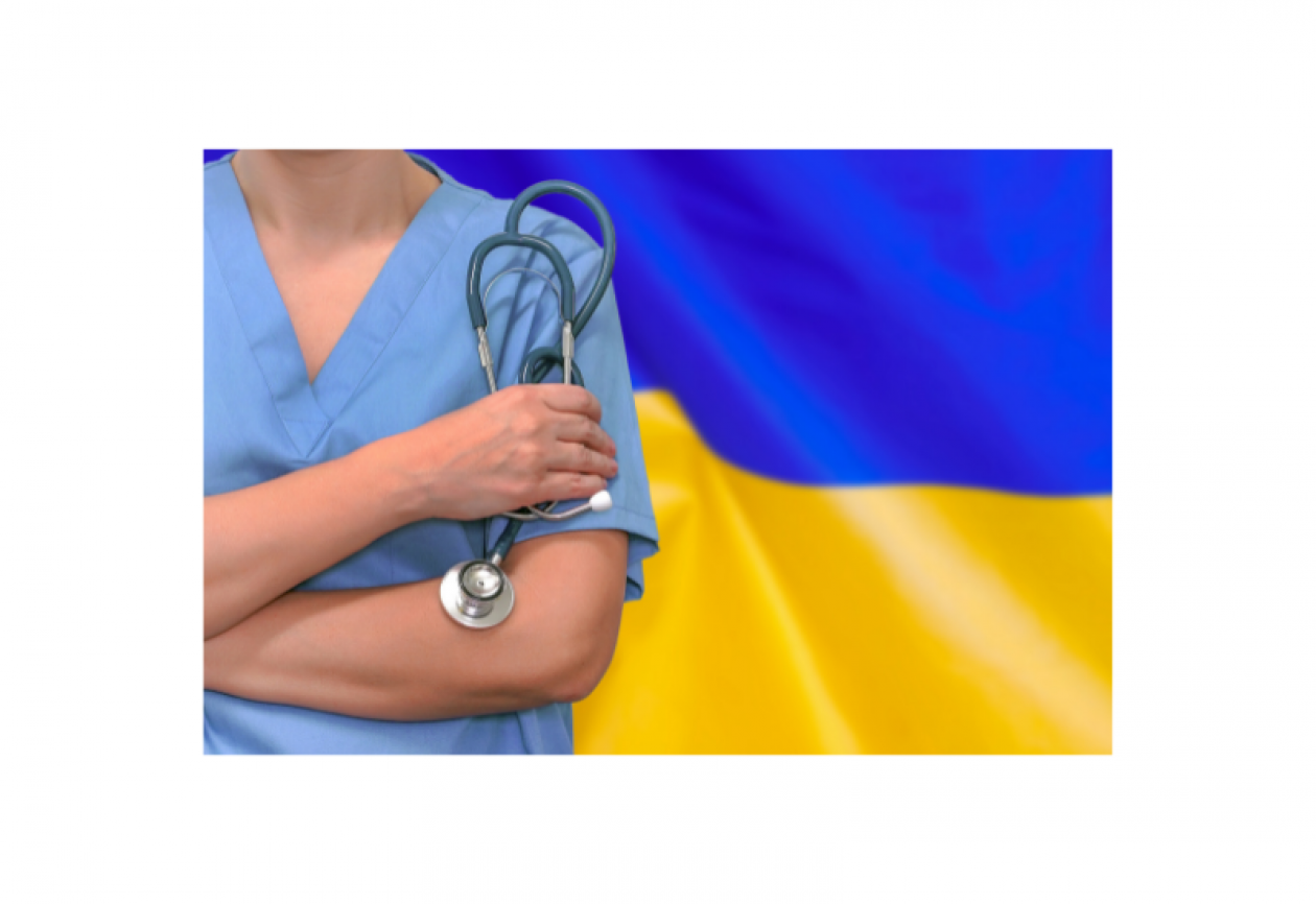 Nurse from neck to waist, holding a stethoscope. Background is Ukraine flag.