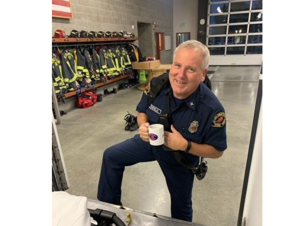 Jerry in a firefighter uniform in a fire station setting