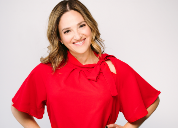 Melissa Berry in a red blouse smiling facing forward