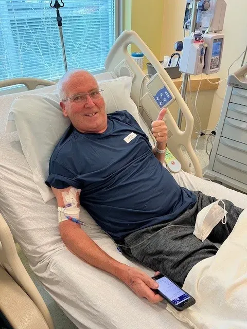 Jerry in a hospital bed during cancer treatment